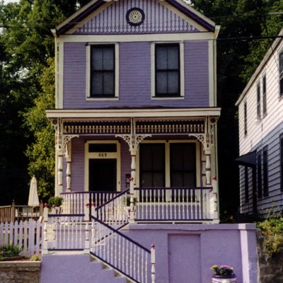 Purple Painted Lady Victorian home facade historic restoration  